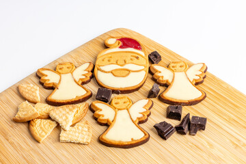 Different tasty Christmas cookies on wooden table, top view