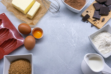 Process of making chocolate  madeleines Ingredients for chocolate cookies. Chocolate French Madeleine cookies. Top view.