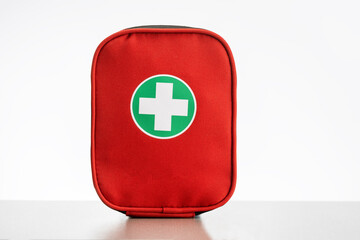 A first aid kit on the table on white background.