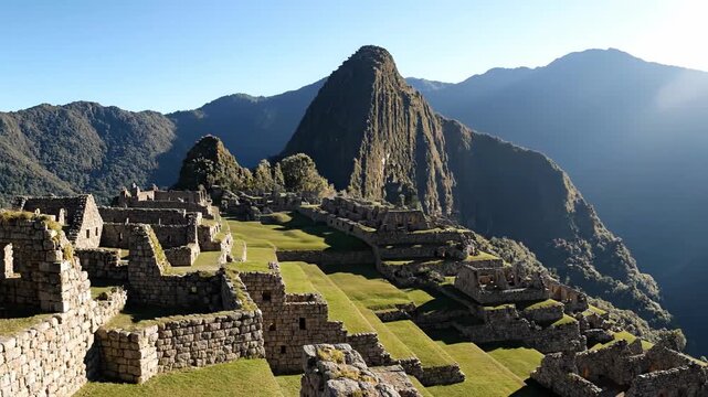 Panorama of the green mountain peaks and ancient Inca ruins in the Himalayas and Andes valleys under a cloudy sky