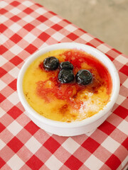 Creme Brulee Dessert with Blueberries on Table