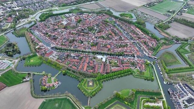 Aerial views of the historic fortified  town of Brielle, Den Briel, The Netherlands. View from the drone of star-shaped Fort Brielle showcasing canals, historic architecture, and vibrant cityscape