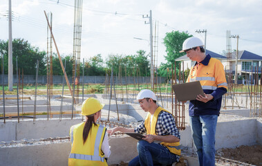 Male and female engineers who are Asian professionals in the construction industry focus on village design and architecture to create sustainable houses for people to rent and sell.