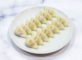Delicious dumplings on a white plate ready to eat