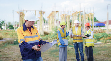 Male and female engineers who are Asian professionals in the construction industry focus on village design and architecture to create sustainable houses for people to rent and sell.