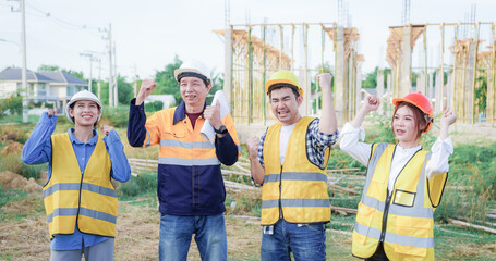 Male and female engineers who are Asian professionals in the construction industry focus on village design and architecture to create sustainable houses for people to rent and sell.