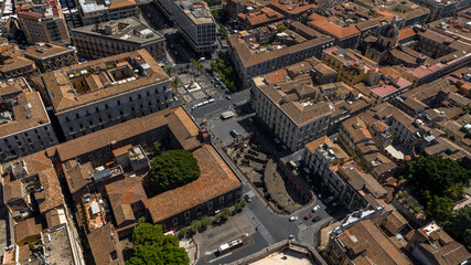 Aerial view of Piazza Stesicoro in the historic center of the city of Catania, Sicily, Italy. It is a rectangular city square in the Sicilian town. It is a sunny summer morning. © Stefano Tammaro