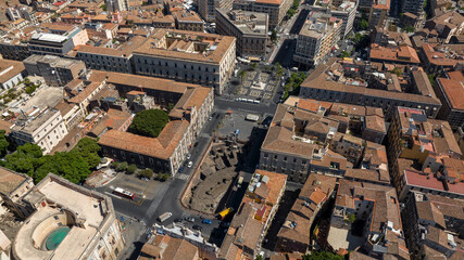 Obraz premium Aerial view of Piazza Stesicoro in the historic center of the city of Catania, Sicily, Italy. It is a rectangular city square in the Sicilian town. It is a sunny summer morning.