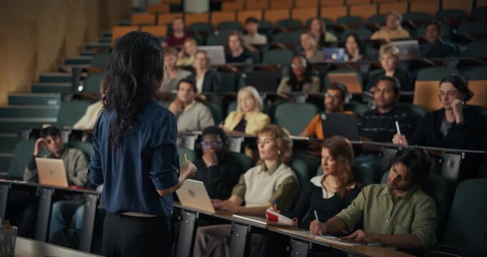 University Professor Guides an Interactive Lecture on Creativity, Problem Solving, Collaboration, Global Citizenship, Digital Literacy, and Personal Growth While Students Take Notes, Ask Questions