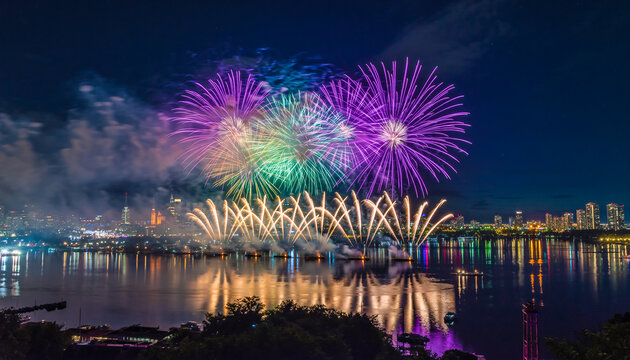 Grand Purple and Green Fireworks Display Over City River with Reflections - Powered by Adobe