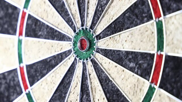 playing darts pulling and throwing new round of darts