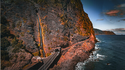 Dramatic Coastal Road and Waterfall on Madeira Island © Emanuele