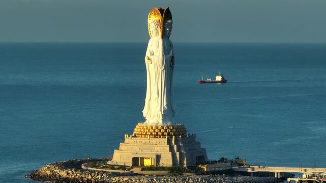 Buddhism Guanyin statue at seaside in nanshan temple, hainan island , China, words mean blessing and mercy