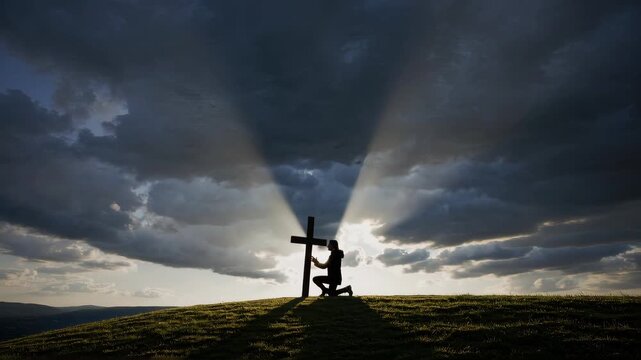a dramatic scene of a person kneeling in prayer beside a cross, powerful rays of light breaking through dark storm clouds, divine and spiritual atmosphere