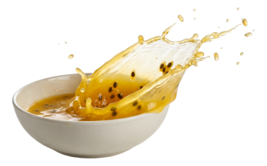 Passion fruit juice entering a ceramic bowl, a vibrant splash with passion fruit seeds scattered.