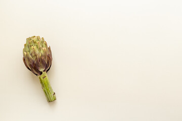 Top view of a whole heads of purple artichokes. Vegetable ready to cook