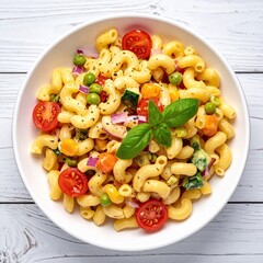 Colorful pasta salad in white bowl, featuring pasta, cherry tomatoes, peas, carrots, and red onion, topped with fresh basil