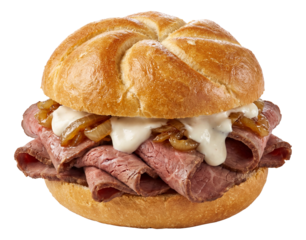 Roast beef sandwich with arranged layers of roast beef, horseradish sauce, and caramelized onions on a kaiser roll.