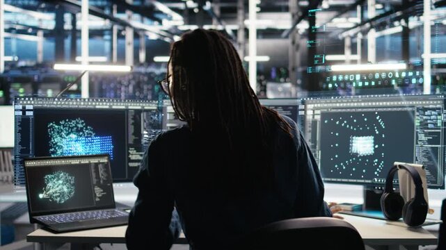 Programmer in data center using holographic simulation to visualize AI LLM with VFX HUDs. IT specialist in server hub oversees artificial intelligence infrastructure using digital twin visualization