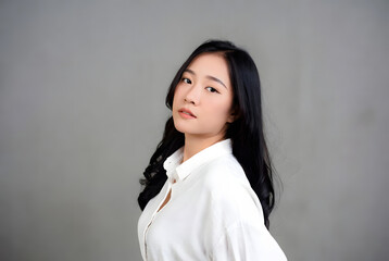 asian woman portrait solid color background