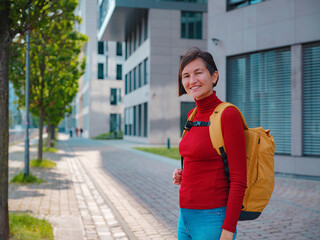 Tourist woman explores modern Frankfurt, walking through vibrant streets with contemporary architecture, skyscrapers, and urban spaces, enjoying lively atmosphere of modern side.