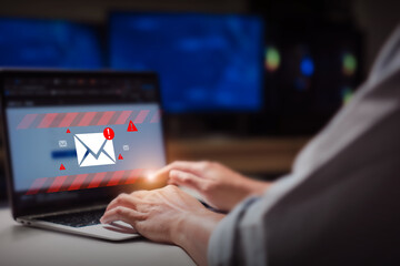 person typing on laptop receives scam notification, illustrating cybersecurity risk and data breach threat, Spam mail pop-up warning. E-mail inbox with spam virus message, Trash and junk mail, scam.