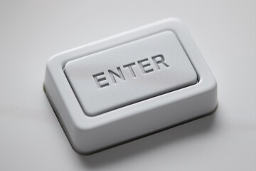 ENTER key for sterile healthcare control interface, minimal medical-grade button with embossed lettering, seamless white surface, hygienic tactile input for diagnostics and clinical systems
