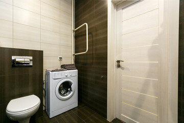 modern bathroom room with toilet and washing machine