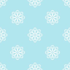 Seamless white snowflake pattern on light blue background. Elegant winter ornament for Christmas decor, holiday wrapping paper, and textile.
