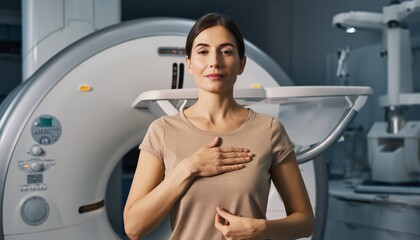A woman getting mammogram to check for breast cancer at imaging diagnostic center showing ok sign good diagnostic results