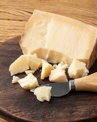 Parmesan cheese over wooden table