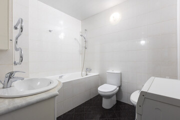 modern bathroom room with toilet and washing machine