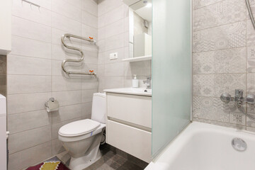 modern bathroom room with toilet and washing machine