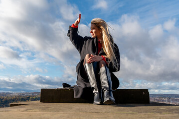 Woman sitting and enjoying a sunny winter day in December