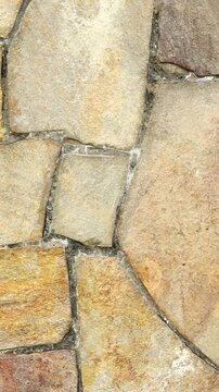 Vertical Video: Close-up of Rustic Stacked Stone Wall Texture with Natural Grout, Old World Surface: Rough Stone Pattern Wall Background, Ideal for Mobile Stories/Reels