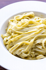 Close-Up of Creamy Pesto Tagliatelle Pasta
