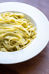 Close-Up of Creamy Pesto Tagliatelle Pasta
