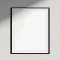 Minimalist black frame mockup on a white wall with shadow.