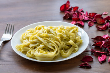 Close-Up of Creamy Pesto Tagliatelle Pasta
