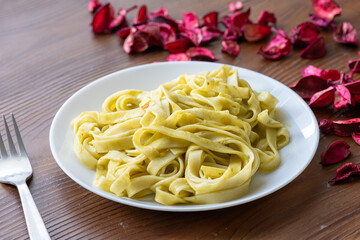 Close-Up of Creamy Pesto Tagliatelle Pasta
