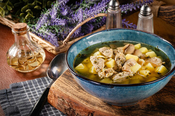 Pure sour rye soup with white sausage, potatoes and mushrooms.