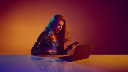 Woman reacting with excitement to winning online casino moment. Concept of emotional peak, digital...