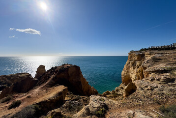  Cave along the Algarve coast in Portugal. Blue sky seen from inside the cave on the cave tour boat.