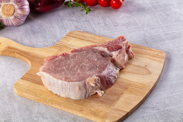 Raw pork steak with bone