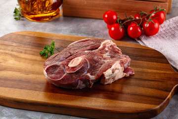 Raw lamb steak with bone