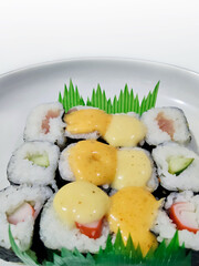 Appetizing Colorful Sushi Platter With Creamy Sauces