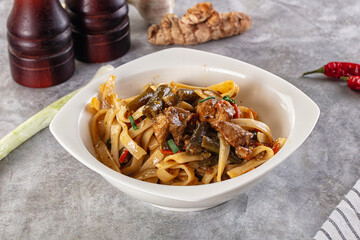 Asian cuisine udon with chicken and vegetables