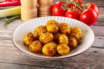 Baked small baby potato with herbs