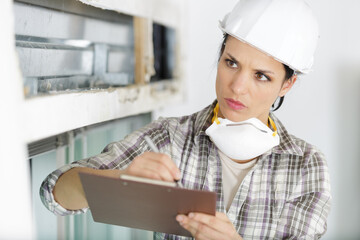 Fototapeta premium female builder with a clipboard