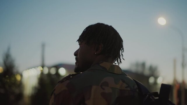 Warrior Keeps Vigil As Darkness Descends, Armed Protector Surveys Shadowy Approaching Dusk Silently, Steadfast Military Figure Silently Monitors Encroaching Darkness During Nighttime Hours